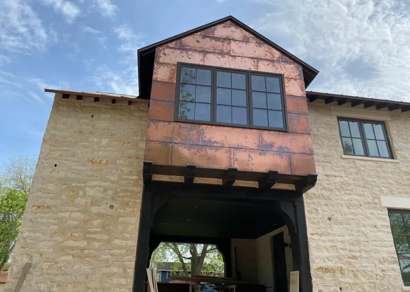Copper metal panel facade on a stone building for Metal Roof Coating in Swarthmore