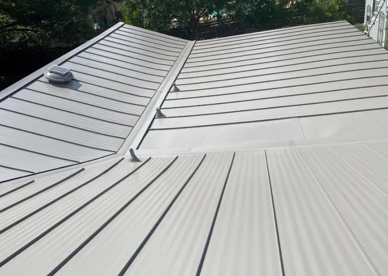 Solar attic fan installed on a metal roof for Roof Ventilation in Swarthmore