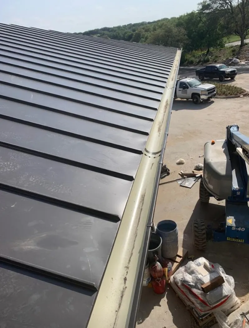 Standing seam panel and gutter detail on a metal roofing jobsite in Swarthmore